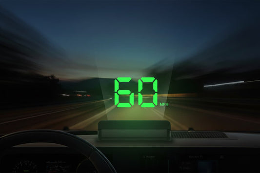 Car HUD speedometer projecting green digital speed display on windshield at night highway