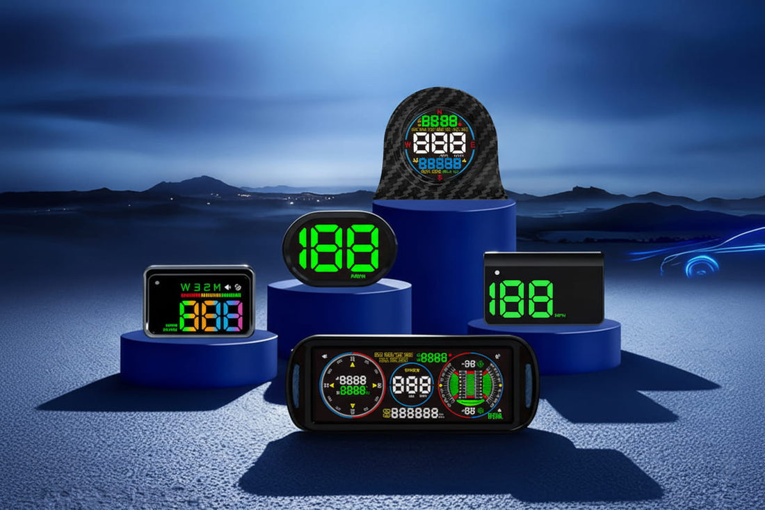 Multiple car HUD heads-up display devices arranged on blue pedestals, featuring GPS speedometers and digital dashboards, against a dramatic dark blue misty mountain backdrop