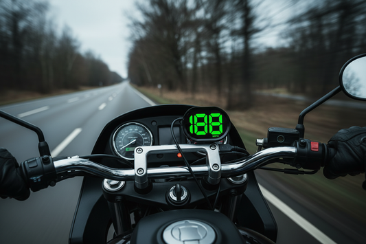KUOWEIHUD K2 GPS digital speedometer mounted externally on a motorcycle dashboard showing 188 MPH on open road
