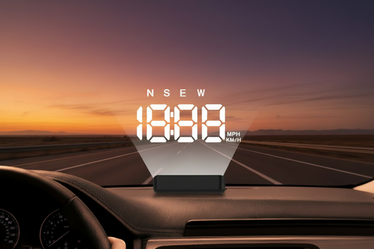 K4 HUD heads-up display mounted on car dashboard, projecting white digital GPS speed, time and compass data onto the windshield, with orange-purple dusk sunset highway in the background — K4 HUD Installation Guide